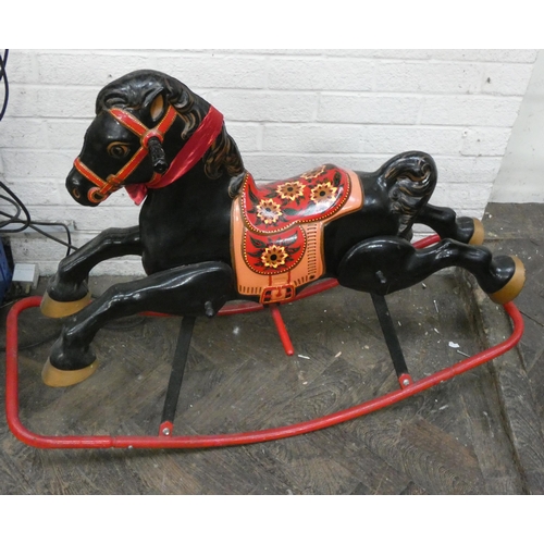 288 - A brightly painted Mobo style metal rocking horse