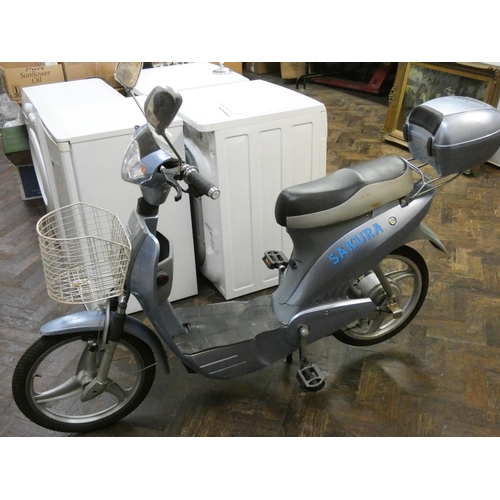 289 - A Sakura moped style electric bike with one key, charger etc and small rear top box