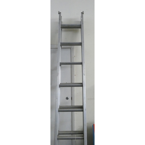 325 - A nine rung double extending aluminium ladder