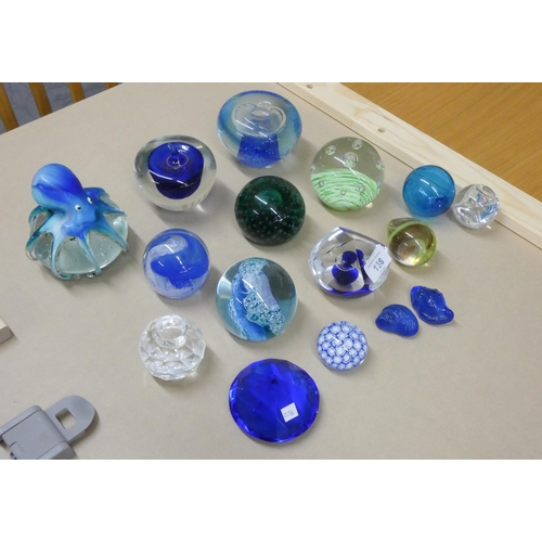 138 - A collection of blue glass collectable paperweights