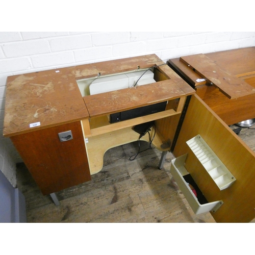 225 - A Futura sewing machine in cabinet