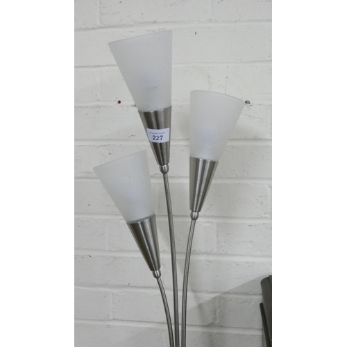 227 - A modern uplighter brush chrome floor lamp