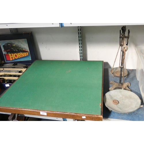 357 - A card table with fold away legs and a set of old balance scales