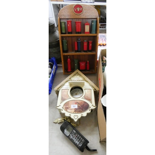 389 - A battery operated Cuckoo clock, a very large old Nokia mobile phone and wall hanging bracket contai... 