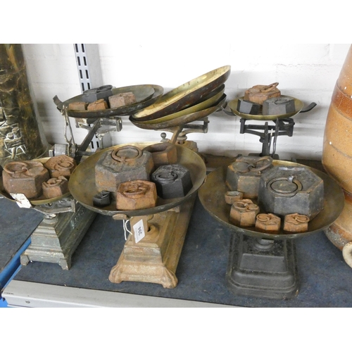 394 - Three large old sets of balance scales and a large quantity of old weights