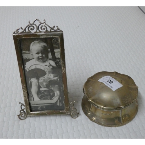 65 - A decorative silver photo frame and a silver lidded trinket box