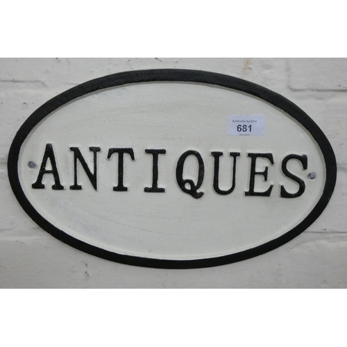 668 - A wall hanging cast iron Antique sign