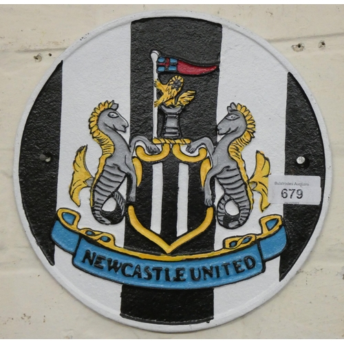 669 - A wall hanging cast iron Newcastle United Football Club sign