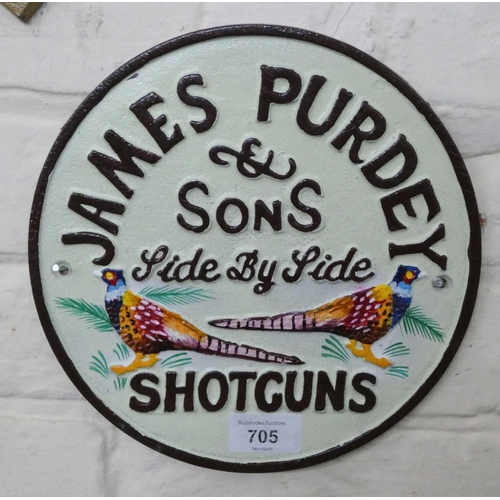 688 - A wall hanging cast iron Purdey Shotguns sign