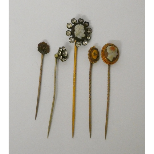 426 - Two antique cameo set stickpins, the classical lady's head marked 15ct, both cased, two 15ct gold st... 