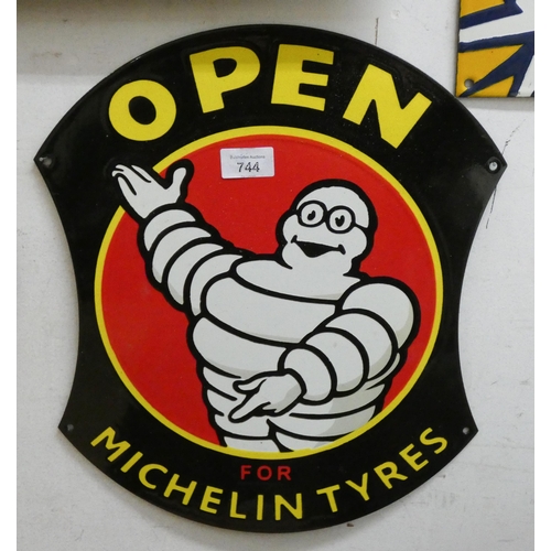 744 - A Michelin open metal wall hanging sign, 16