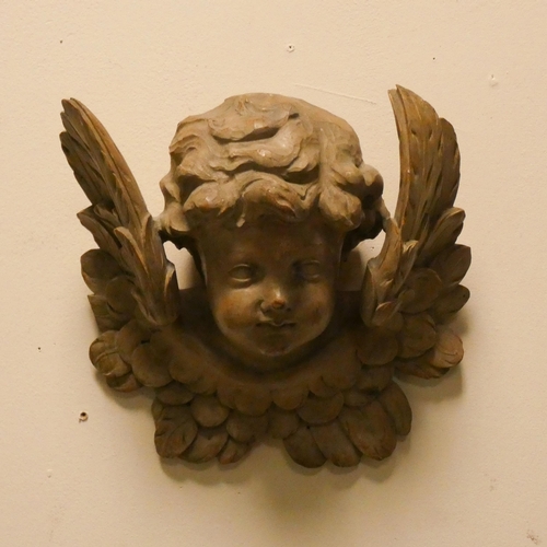 152 - A Victorian carved cherub wall ornament