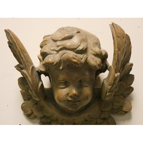 152 - A Victorian carved cherub wall ornament