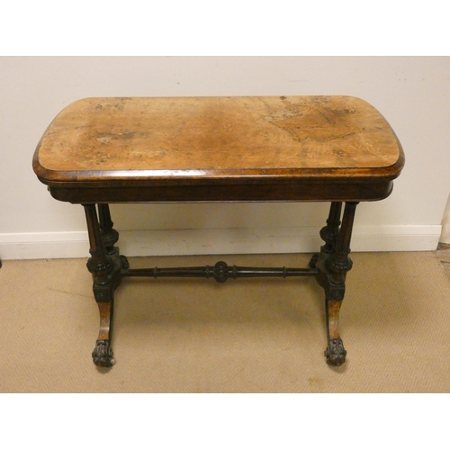 155 - A Victorian inlaid walnut folding top card table on a carved stretcher style base, 37