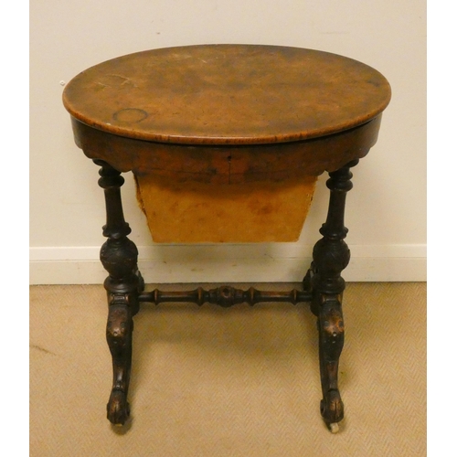 156 - Victorian walnut oval work box on carved stretcher base with fret work decorated interior, 24 1/2