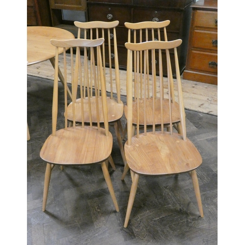 161 - An Ercol blonde elm drop leaf dining table and four matching high stick back dining room chairs