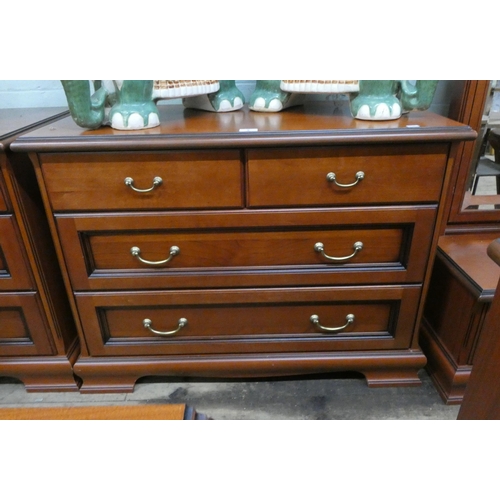 4 - A modern mahogany chest of two long and two short drawers with brass handles, 3'3 wide