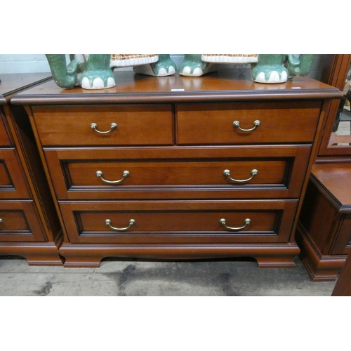 5 - A modern mahogany chest of two long and two short drawers with brass handles, 3'3 wide