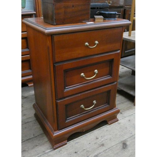 9 - A mahogany three drawer bedside chest matching previous lot