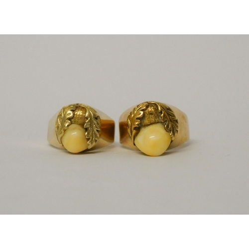 430 - A pair of German 14k gold tooth mounted rings, 13.9g