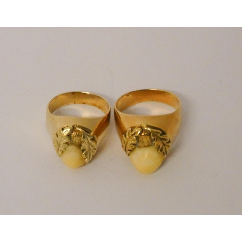 430 - A pair of German 14k gold tooth mounted rings, 13.9g