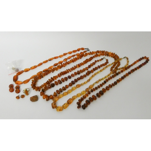 431 - A collection of five Baltic amber bead necklaces, silver mounted stud earrings, cufflinks etc