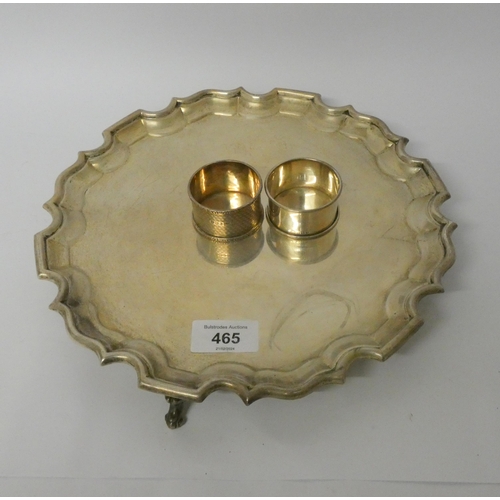 465 - A silver salver, the reverse with presentation inscription, London 1905, and two silver napkin rings... 