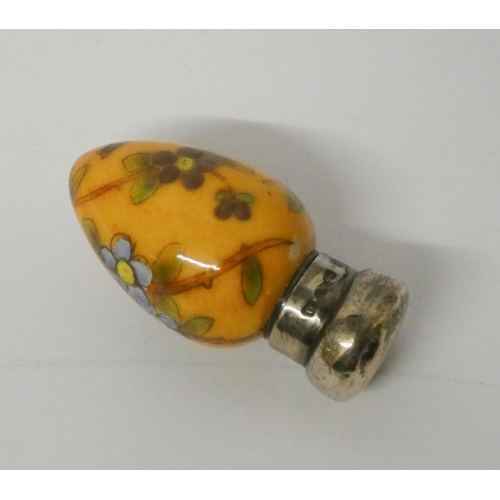 468 - Victorian egg-shaped scent bottle, painted  with forget me nots on an amber ground with silver cap, ... 