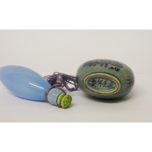 470 - An oriental porcelain snuff bottle and a blue glass scent flask