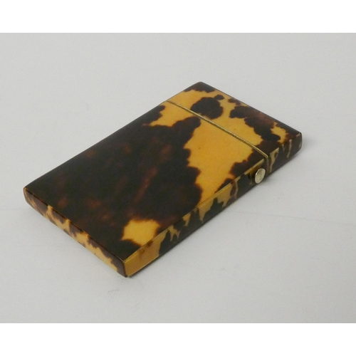 480 - A Victorian tortoiseshell and silver mounted card case 8.5 cms x 5cms