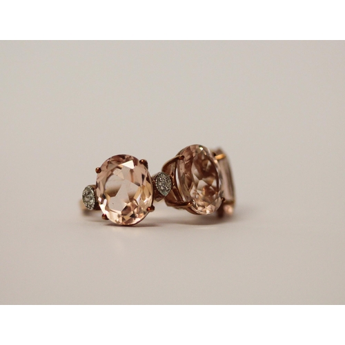 510 - A modern three stone Morganite and diamond dress ring, on 9ct rose gold band. ring size J, 2.8g