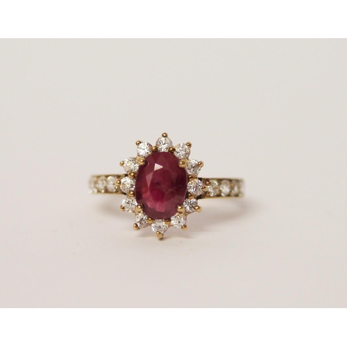 517 - A ruby and zircon dress ring on 9ct gold band. Ring size M