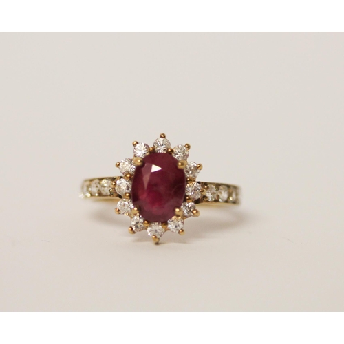 517 - A ruby and zircon dress ring on 9ct gold band. Ring size M