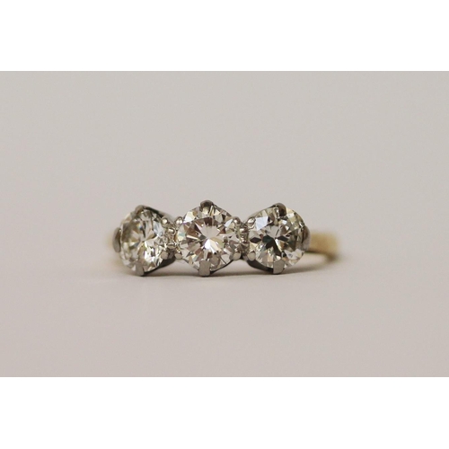 405 - A vintage three stone diamond ring, on 18ct gold and platinum band. Ring size I, in original box