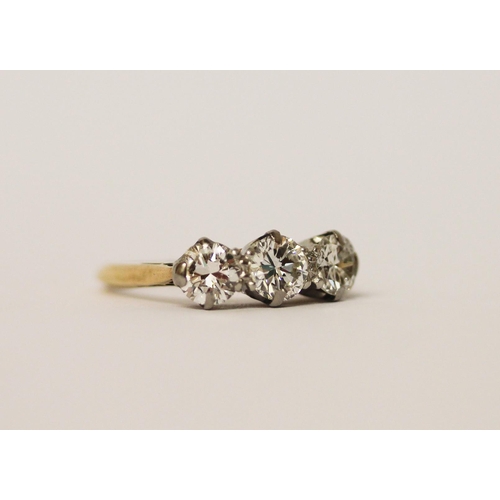 405 - A vintage three stone diamond ring, on 18ct gold and platinum band. Ring size I, in original box