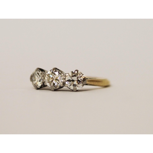405 - A vintage three stone diamond ring, on 18ct gold and platinum band. Ring size I, in original box