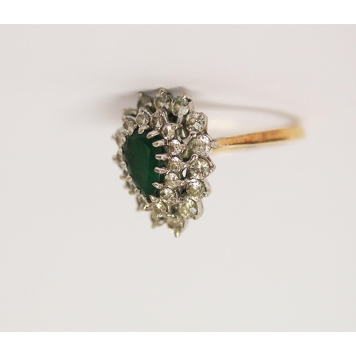 407 - An emerald and diamond cluster ring, the tear drop shaped emerald surrounded by two rows of diamonds... 