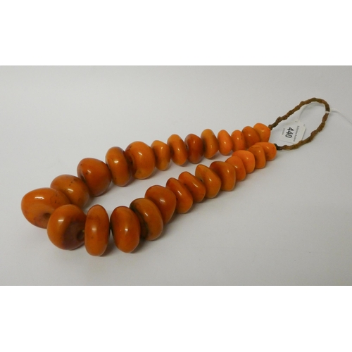 440 - Large amber look bead necklace, largest bead diameter 4.5 cms