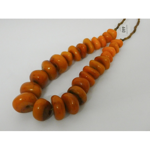 440 - Large amber look bead necklace, largest bead diameter 4.5 cms