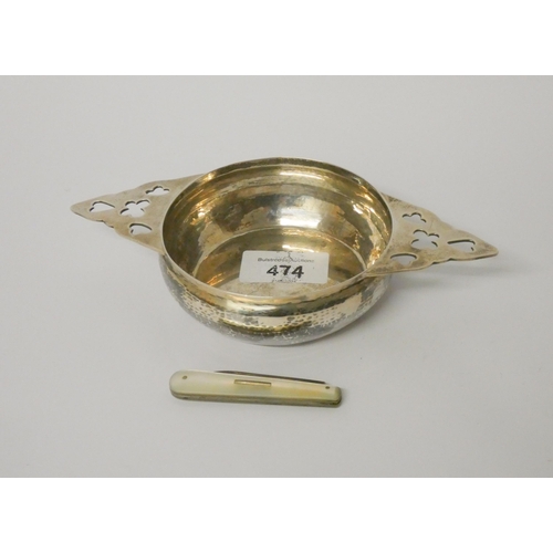 474 - An Art Nouveau silver quaich, Naylor Brothers London 1918 and a silver bladed fruit knife with mothe... 