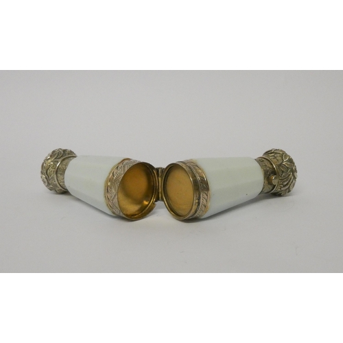 475 - A Victorian double ended scent / snuff bottle,  the faceted shaped body hinging in the middle to a g... 