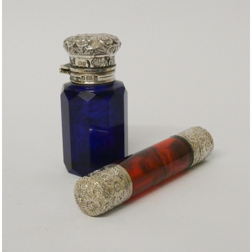 483 - A Victorian double ended ruby glass scent bottle with white embossed metal hinged and screw lids - t... 