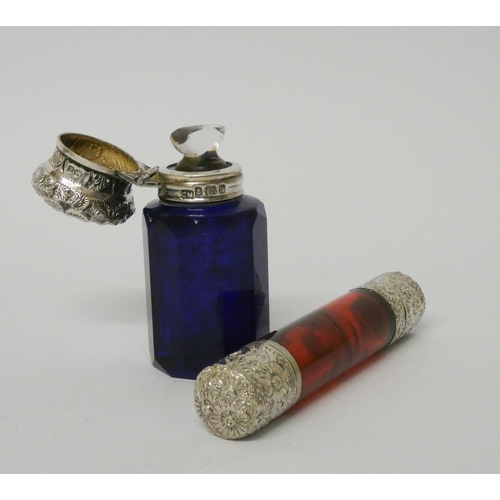 483 - A Victorian double ended ruby glass scent bottle with white embossed metal hinged and screw lids - t... 