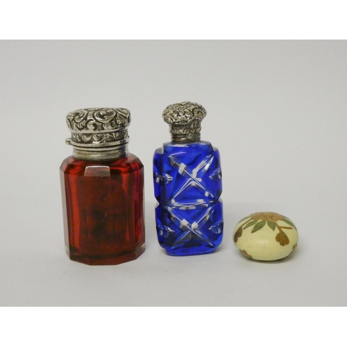 484 - A faceted blue flash glass scent bottle with screw on lid and a Victorian ruby glass scent bottle wi... 