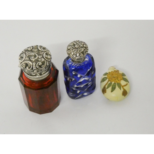 484 - A faceted blue flash glass scent bottle with screw on lid and a Victorian ruby glass scent bottle wi... 