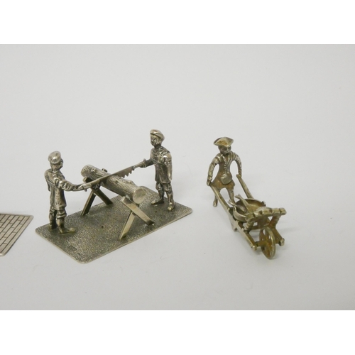 489 - Miniature novelties - soldier firing a cannon, lumberjacks, rickshaw vendor etc.