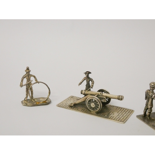 489 - Miniature novelties - soldier firing a cannon, lumberjacks, rickshaw vendor etc.