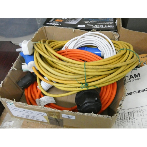 702 - A quantity of 110 volt extension cables and 240 volt to 110 volt cables