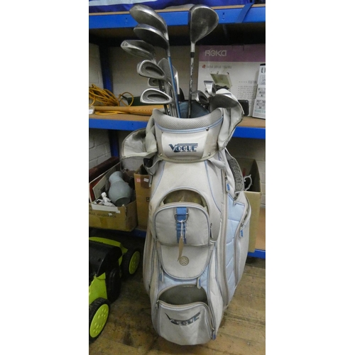 733 - A part set of ladies gold clubs in a Vogue golf bag