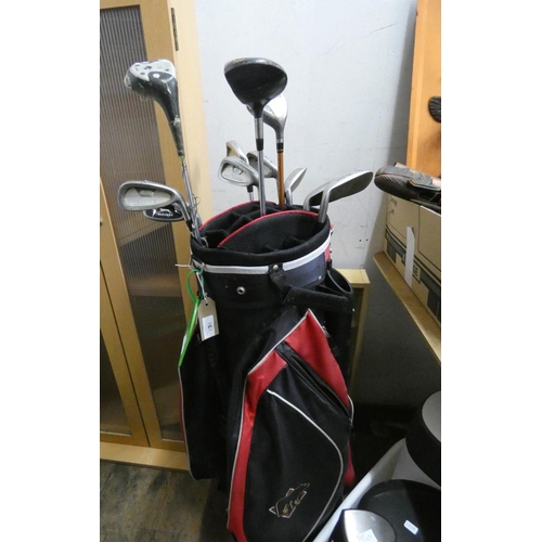 734 - A part set of gents golf clubs in a red and black golf bag